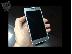 PoulaTo: Samsung Galaxy Alpha Asimenis mazi me to kouti tou
